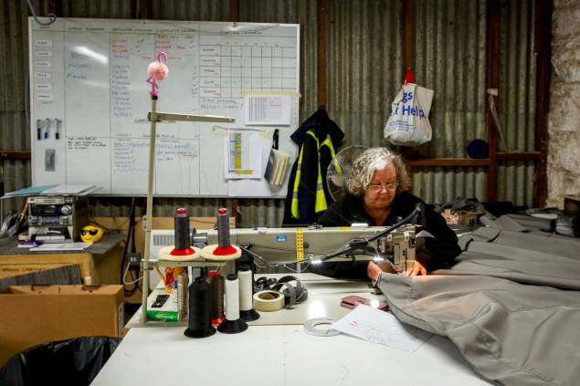 A machinist sews at Lang&Potter, providers of soft furnishings to Princess Yachts based at their South Yard site.
Photographer: Luke MacGregor/Bloomberg