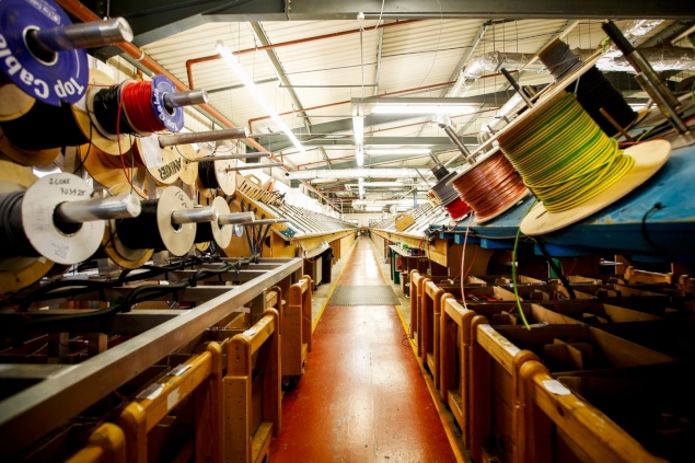 Reels of wire in the loom shop.
Photographer: Luke MacGregor/Bloomberg
